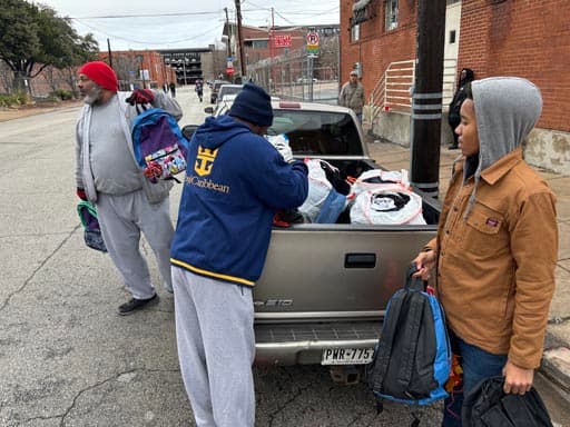 Unloading bags of donations from the truck