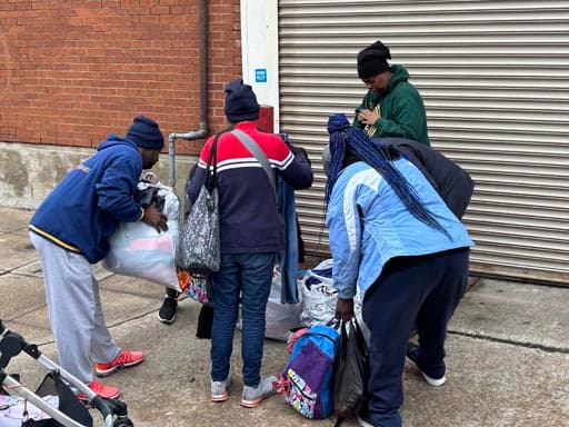 Sorting donated clothing and supplies at the curb